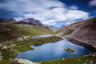 Scenic view of lake and mountains against sky