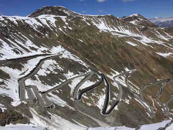 Scenic view of snow covered mountains against sky
