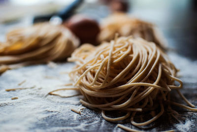 Close-up of pasta with egg on table