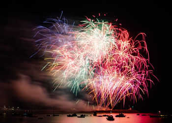 Firework display at night