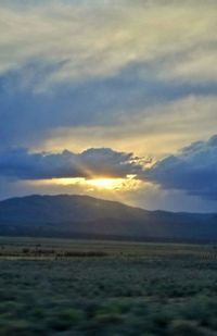 Scenic view of landscape against sky during sunset