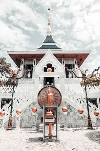 Traditional building against sky during winter