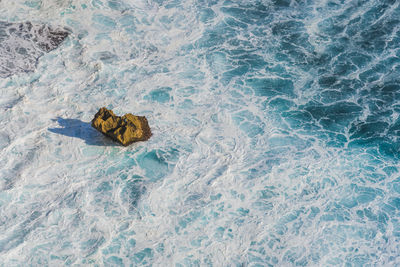 High angle view of waves in sea