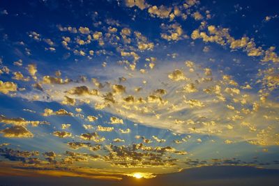 Low angle view of cloudy sky during sunset