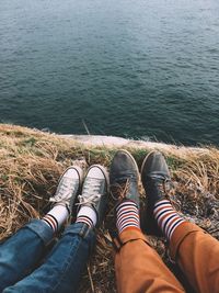 Low section of couple at beach