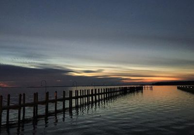 Scenic view of sea against sky at sunset