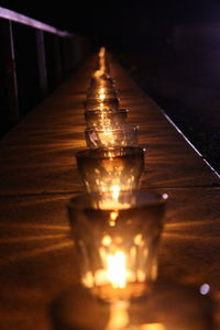 Close-up of illuminated candles in temple