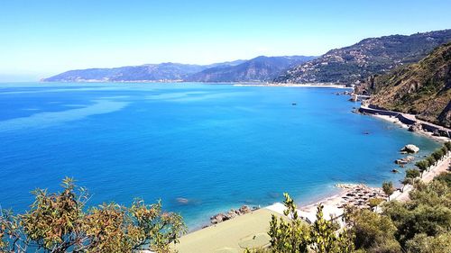 High angle view of bay against clear blue sky