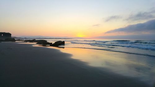 Scenic view of sea at sunset