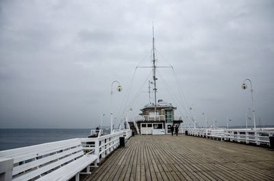 Pier on sea against sky