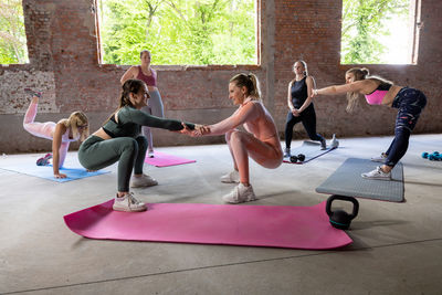 Portrait of woman exercising in gym