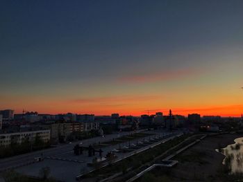 High angle view of buildings against sky during sunset