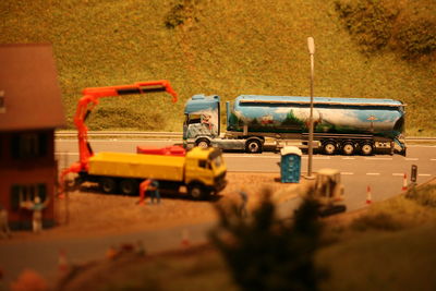 Tilt-shift image of vehicles on country road