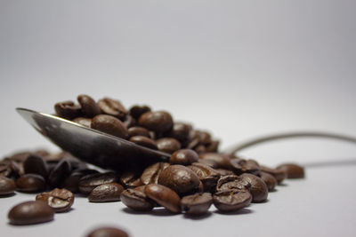 Close-up of coffee beans on table