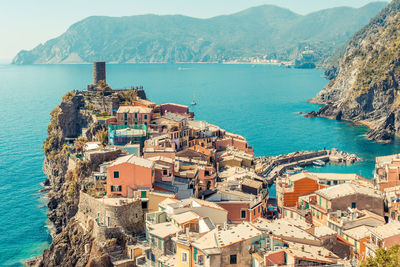 High angle view of townscape by sea