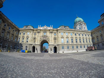 Facade of historic building against blue sky