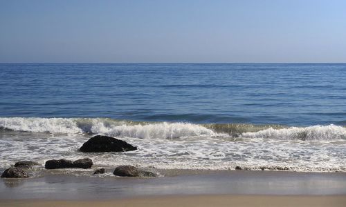 Scenic view of sea against clear sky