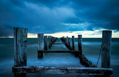 Pier over sea against sky