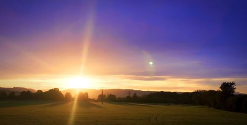 Scenic view of landscape against sky during sunset