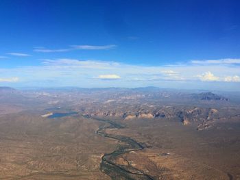 Scenic view of landscape against blue sky