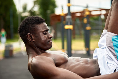 Side view of man exercising in gym