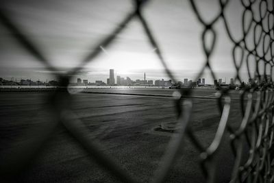 City seen through chainlink fence