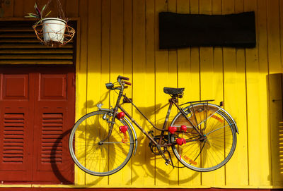 Bicycle parked in front of house