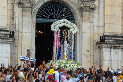 Catholics carry the image of our lady of conceicao da praia during homage