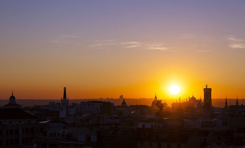 High angle view of city at sunset