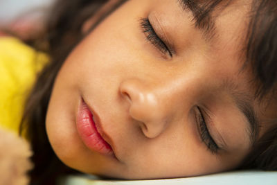 Portrait of girl sleeping at home