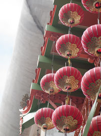 Low angle view of lanterns hanging on building