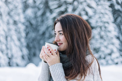 Young woman drinking coffee