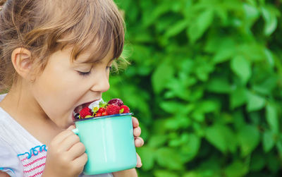 Close-up of girl blowing ice cream