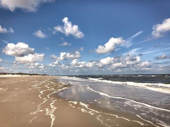 Scenic view of beach against sky