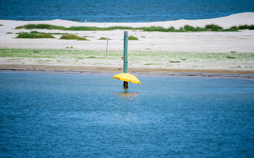 Yellow umbrella on beach