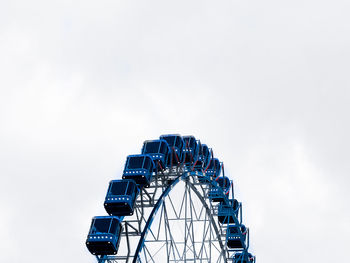 Low angle view of ferris wheel against clear sky