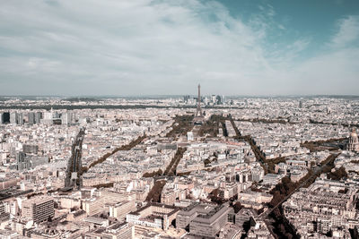 High angle view of paris city buildings against cloudy sky