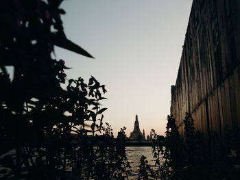 Silhouette of buildings against sky during sunset