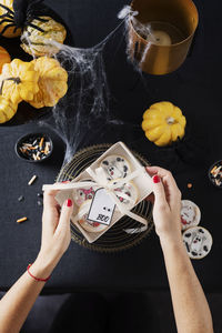 High angle view of woman holding ice cream