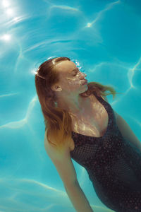 Woman swimming in pool