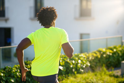 Rear view of man running outdoors