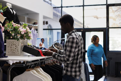 Side view of business colleagues working in office