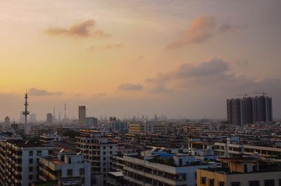 High angle view of buildings against sky during sunset