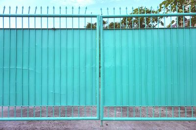 Close-up of closed blue gates