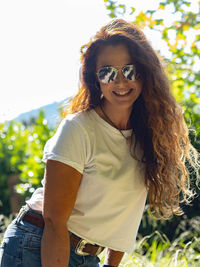 Portrait of smiling woman wearing sunglasses