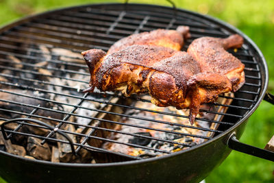 High angle view of meat on barbecue grill