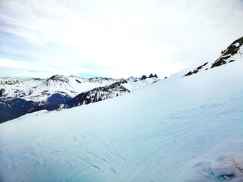 Scenic view of snow covered mountain against sky