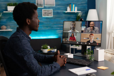 Businessman attending online business meeting