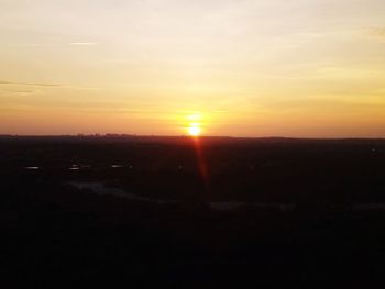 Scenic view of landscape against sky during sunset