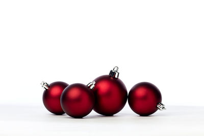 Close-up of tomatoes against white background